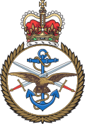 A crest with a crown above a laurel wreath, featuring an anchor, eagle, and crossed swords at the center. British Armed Forces is a Plasloc client.