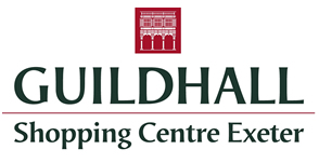 Guildhall Shopping Centre Exeter logo with a red icon of an arched building above green text stating the centre’s name and location. Guildhall Shopping Centre Exeter is a Plasloc client.